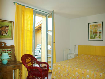 The yellow bedroom upstairs opens to the sun terrace